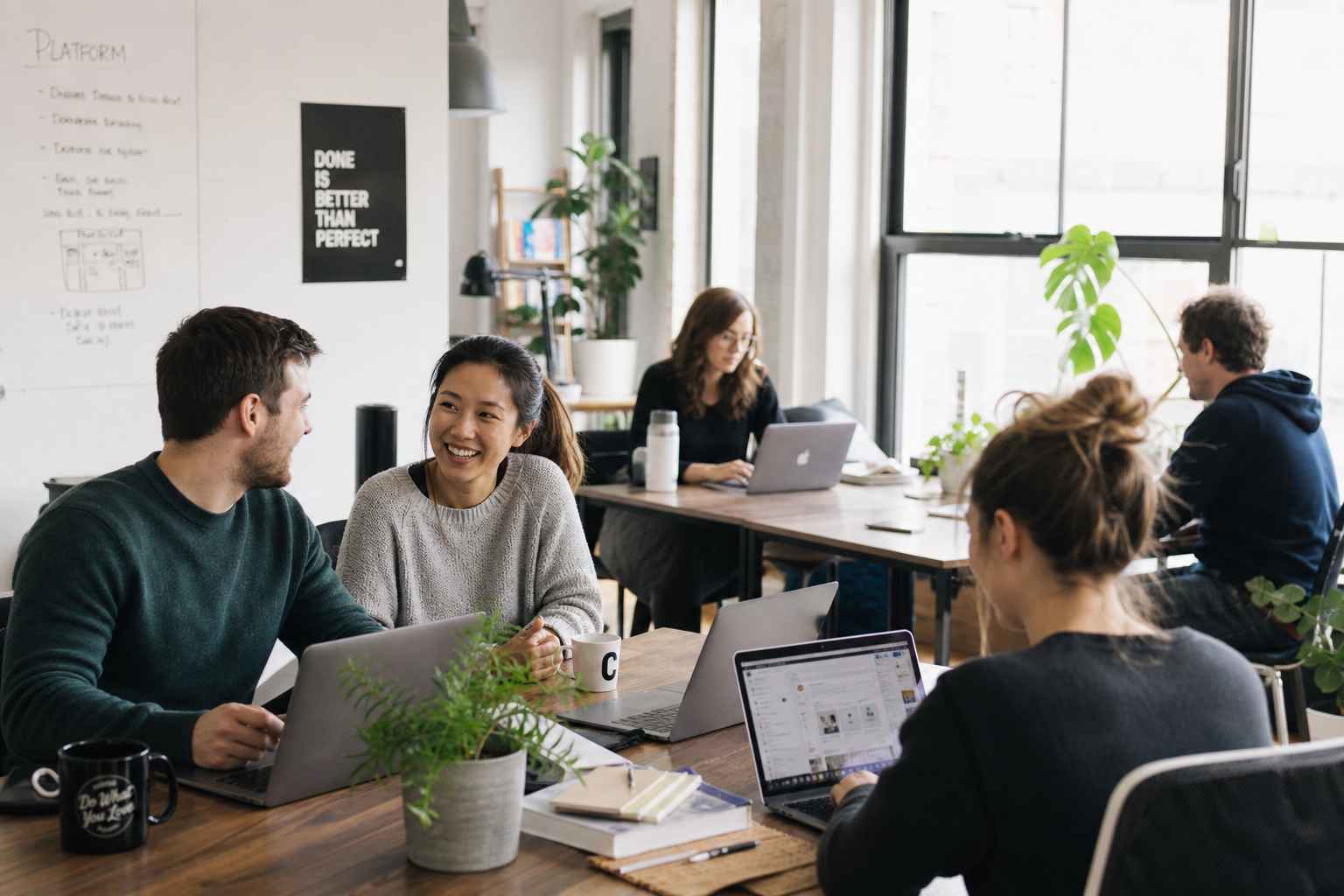 Our team collaborating in a bright workspace